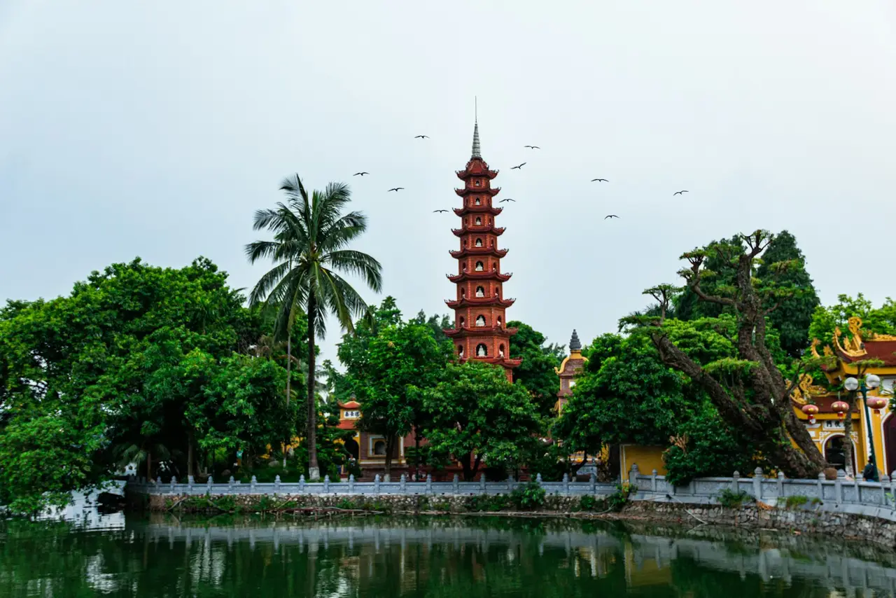 a tall tower sitting next to a body of water